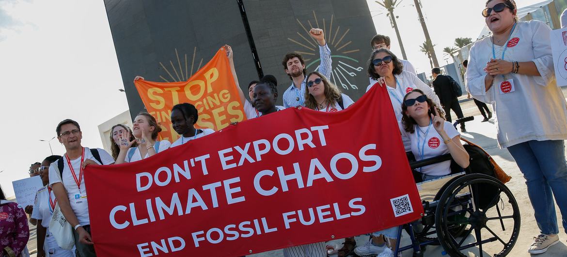 Youth activists protest at COP27 in Sharm El-Sheikh demanding leaders to address ending the use of fossil fuels.